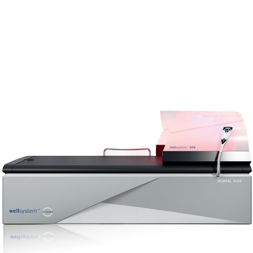 Łóżko do suchego masażu wodnego Wellsystem Spa z podświetleniem LED w kolorze różowym.