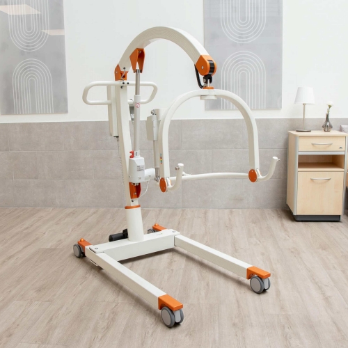 Podnośnik transportowo kąpielowy Carlo Alu Comfort EP 185 w pomieszczeniu z jasną podłogą i szarą ścianą.